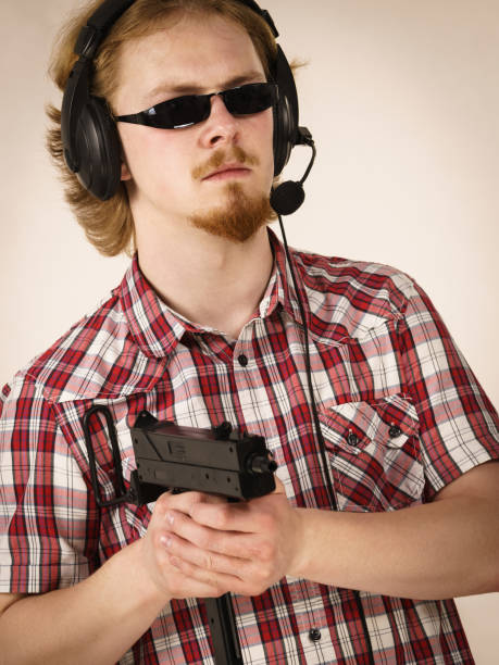 istock Gamer man shooting from gun 1191432033