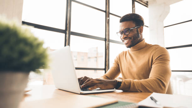 istock Satisfied african american manager typing on keyboard 1191432040