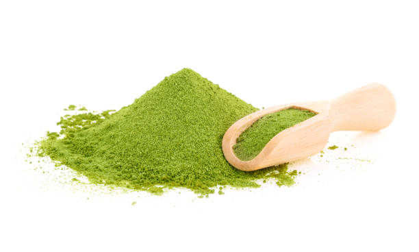 green tea powder isolated on white background green tea powder isolated on white background chlorella stock pictures, royalty-free photos & images