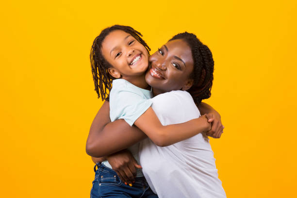 istock Happy black woman hugging her adopted child 1191435054