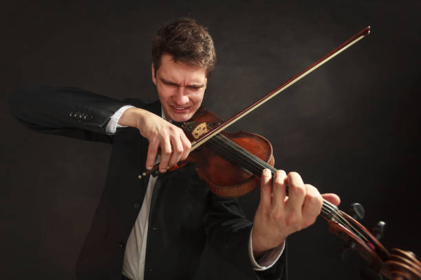 istock Man playing violin showing emotions and expressions 1191435217