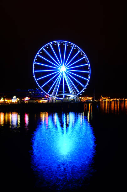istock Giant Seattle Great Wheel observation in night reflection at Pier 57 in Seattle, Washington 1191437667