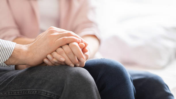 istock Married couple holding each other hands, giving psychological support 1191437858