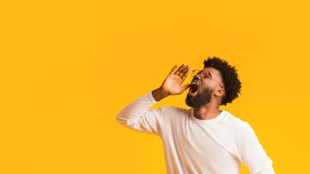 istock African american man in glasses screaming with excitement 1191439780