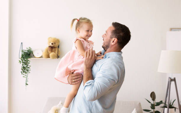 istock Caucasian daddy playing with cute adopted daughter 1191441907