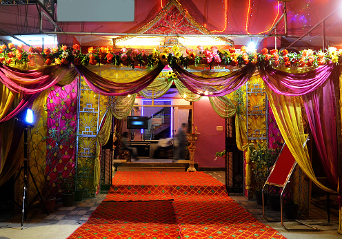 Decoration  at the gate of wedding reception or banquet hall at night front view. Banquet hall is multipurpose like Wedding ceremony, party, birthday parties etc.