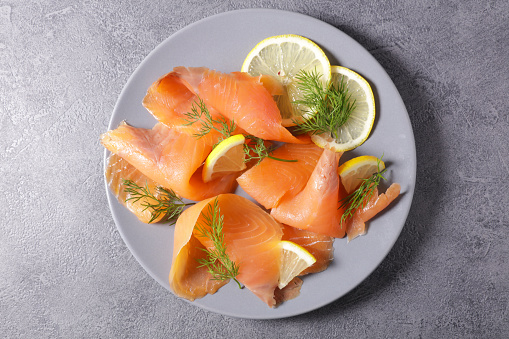 smoked salmon with lemon and dill, top view