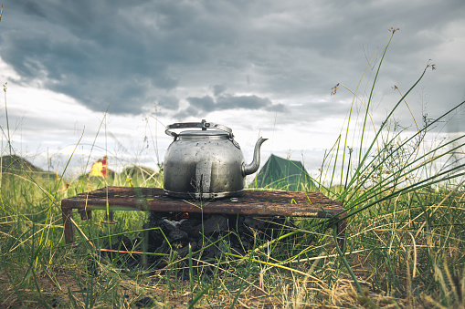 tea kettle on campfire in bush camp on Zambezi island