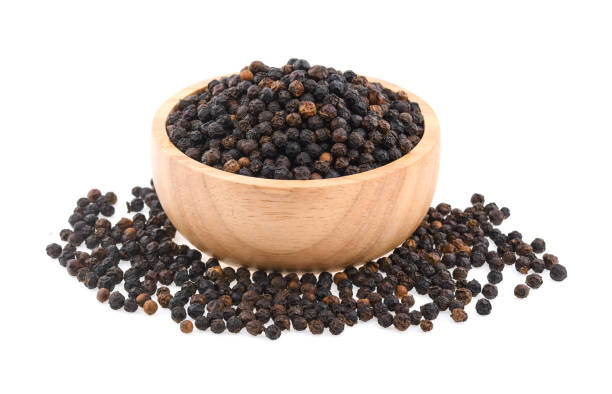 istock Black pepper corns isolated on white background 1191446648