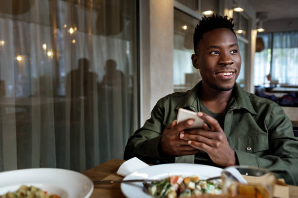 istock young african american man using laptop in cafe 1191449441