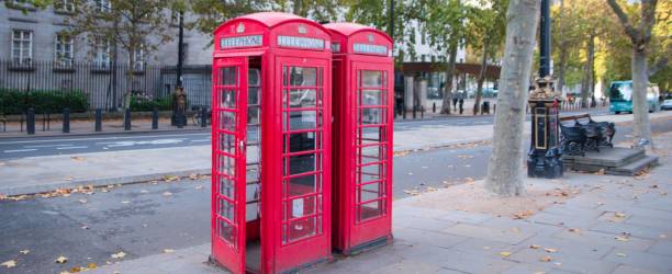 istock Red phonbooth in a London street 1191450400
