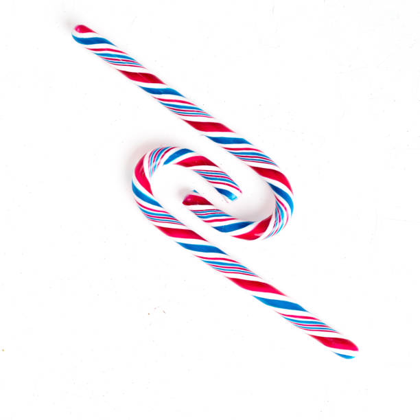 istock Candy canes on a white surface, top view, place for text 1191450454