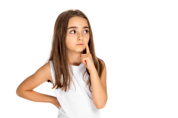 istock Little girl looking up thinking searching for ideas or debating 1191452718