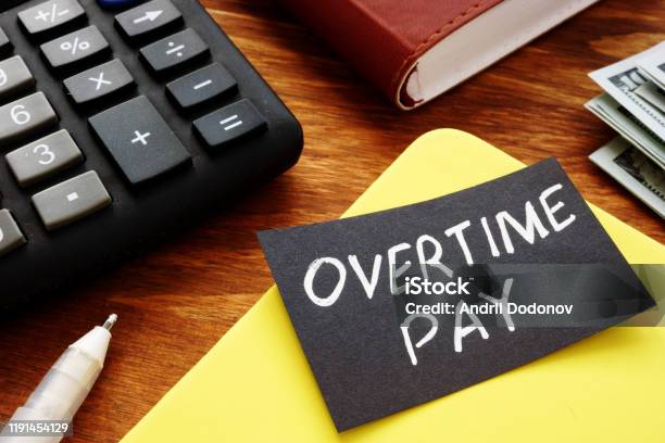 Text Sign Showing Hand Written Words Overtime Pay Stock Photo - Download Image Now - Working Late, Paying, Time