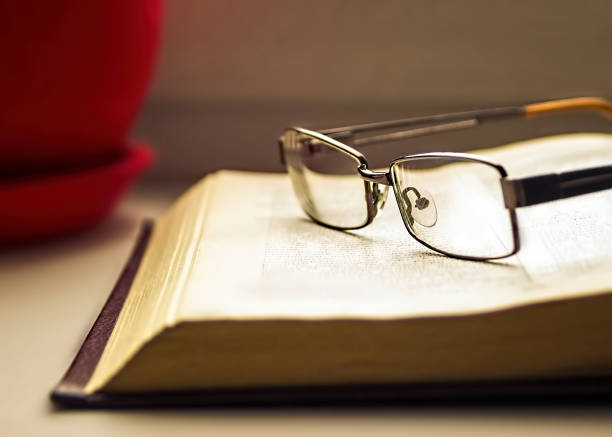 istock Glasses and books - classy attribute of intelligence. Reading, learning 1191454273