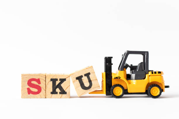 istock Toy forklift hold wood letter block U to complete word SKU (abbreviation of stock keeping unit) on white background 1191454607