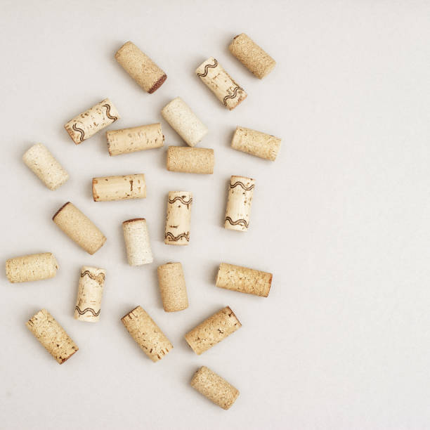 istock Used wine corks on light paper background with copy space. Top view with wooden corks from bottle of wine. Flat lay. 1191454661