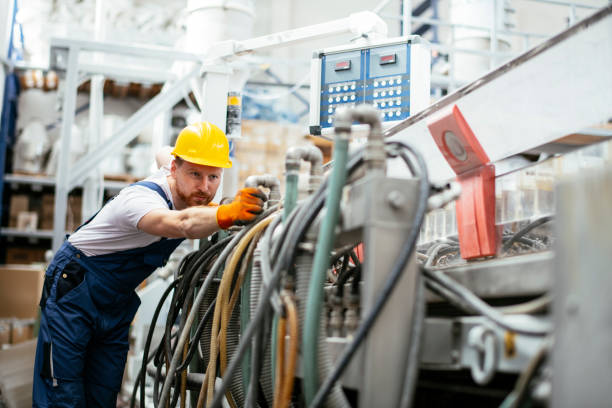 istock Worker in uniform working in factory 1191456158