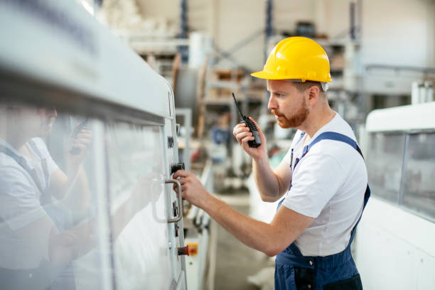 istock Worker in uniform working in factory 1191457520