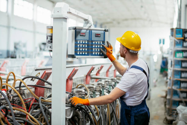 istock Worker in uniform working in factory 1191457992