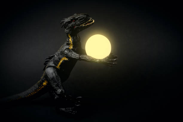 Small colorful dinosaur toy on white background in a row