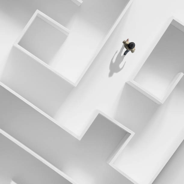 istock business man getting out of a complex maze, surreal abstract concept 1191458810