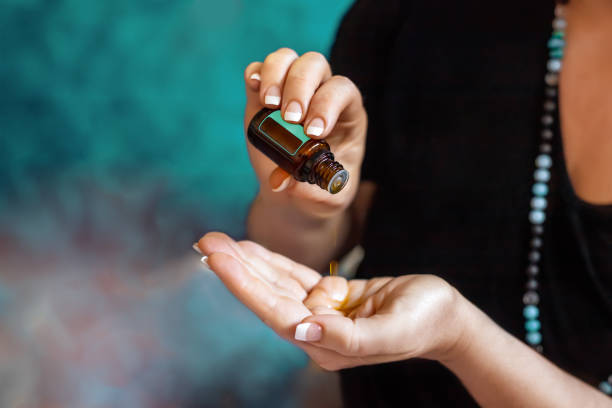 istock Womans hand with essential oil 1191459598