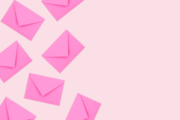 istock Top view of pink envelopes on pastel background. Place for text. 1191460554