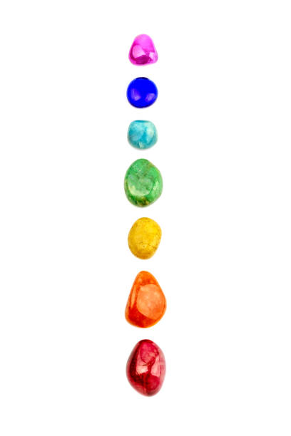 Chakra stones, crystals in a row Chakra stones, crystals in a row on white background, isolated chakra recovery energy gem stock pictures, royalty-free photos & images