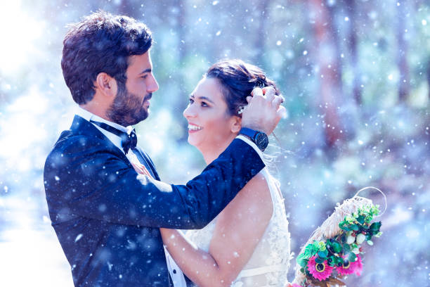 istock Wedding Couple on snow 1191460658