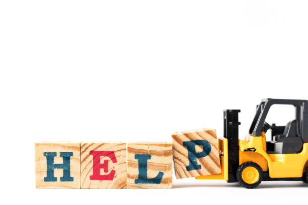 istock Toy forklift hold letter block p to complete word help on white background 1191460744