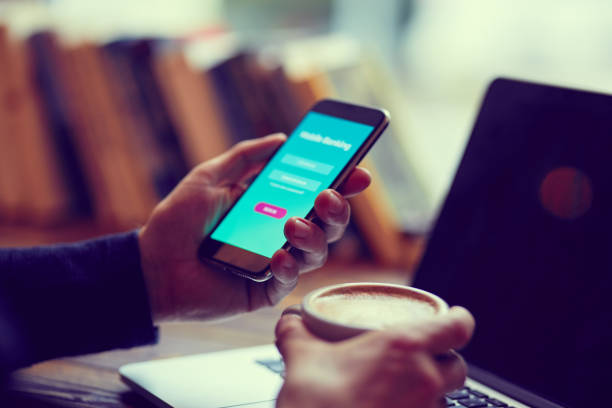 istock Man with cell phone uses internet banking in cafe 1191461084