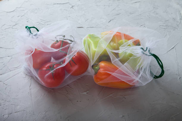 istock vegetables, tomatoes and bell peppers in an eco bag. Zero waste. Flat lay. 1191461156