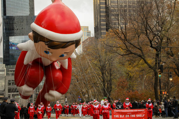 Macy's Parade 2019 New York City, NY, USA- November 28, 2019: Elf on the Shelf flies low due to high winds at the Macy's Thanksgiving Day Parade. book title stock pictures, royalty-free photos & images