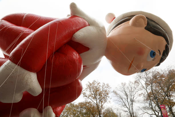 Macy's Parade 2019 New York City, NY, USA- November 28, 2019: Elf on the Shelf is seen from under the balloon as it floats down the street at the Macy's Thanksgiving Day Parade. book title stock pictures, royalty-free photos & images