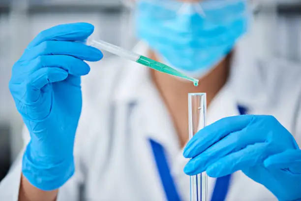 Cropped shot of a scientist conducting an experiment in a laboratory