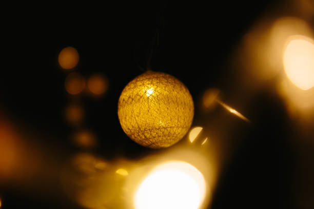 Christmas lights on dark background. Ball shaped.