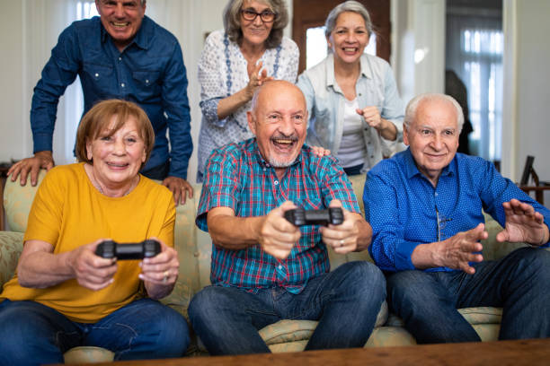 istock Senior friends having fun with video games 1191468619
