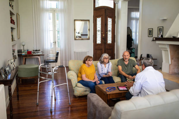 istock Senior patients having conversation with doctor in nursing home 1191468740