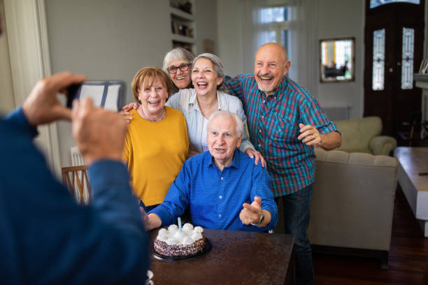 istock Senior people photographing during birthday celebration 1191468927