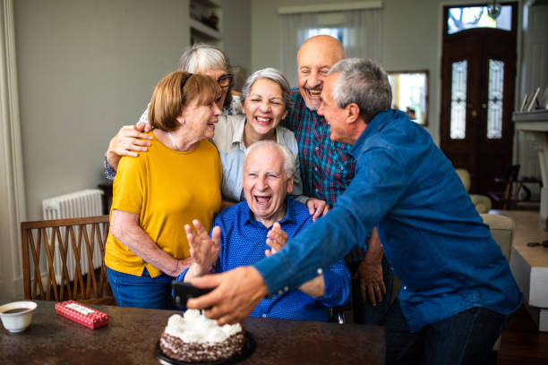 istock Senior friends making selfie while celebrating birthday at home 1191468928