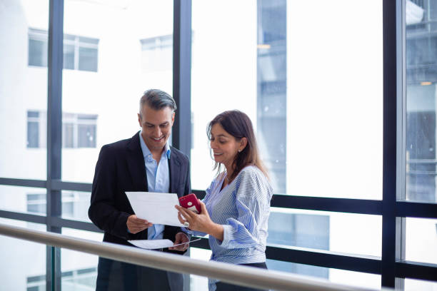 istock Two business people discussing something about their work at the office 1191475372