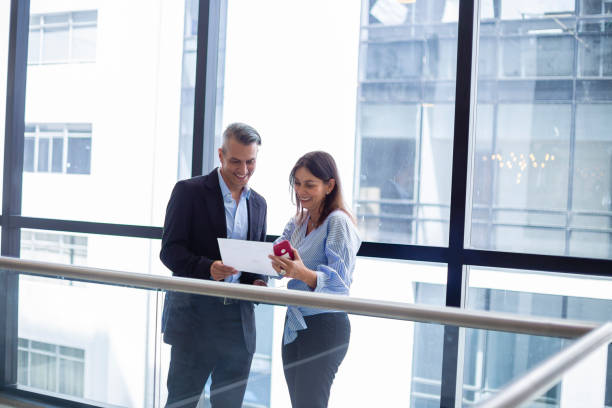 istock Two business people discussing something about their work at the office 1191475401