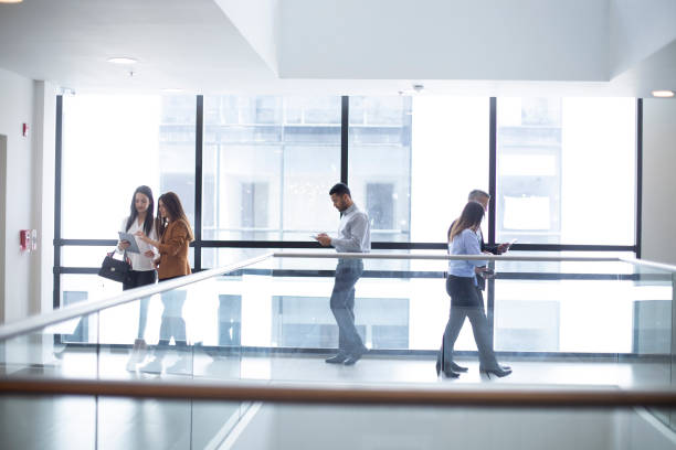 istock Group of people walking at the office 1191475577