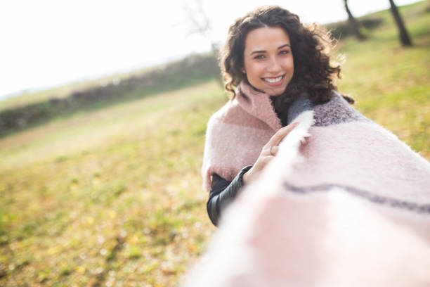 istock A beautiful young woman in autumn day 1191479794