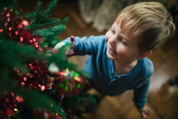 Happy child and mother preparing for Xmas