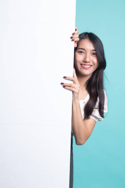 istock Young Asian woman with blank sign. 1191481786