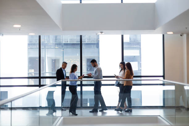 istock Group of people walking at the office 1191481808