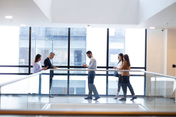 istock Group of people walking at the office 1191481809