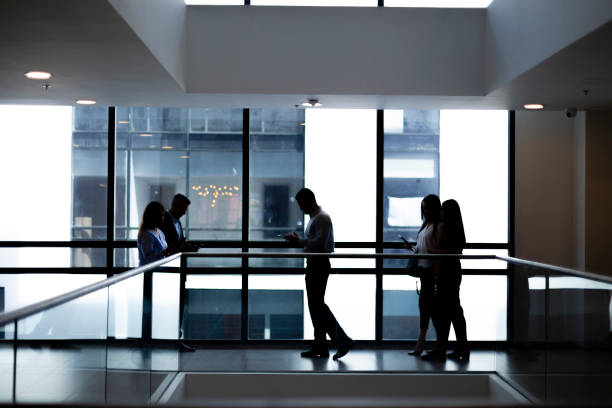 istock Group of people walking at the office 1191481816